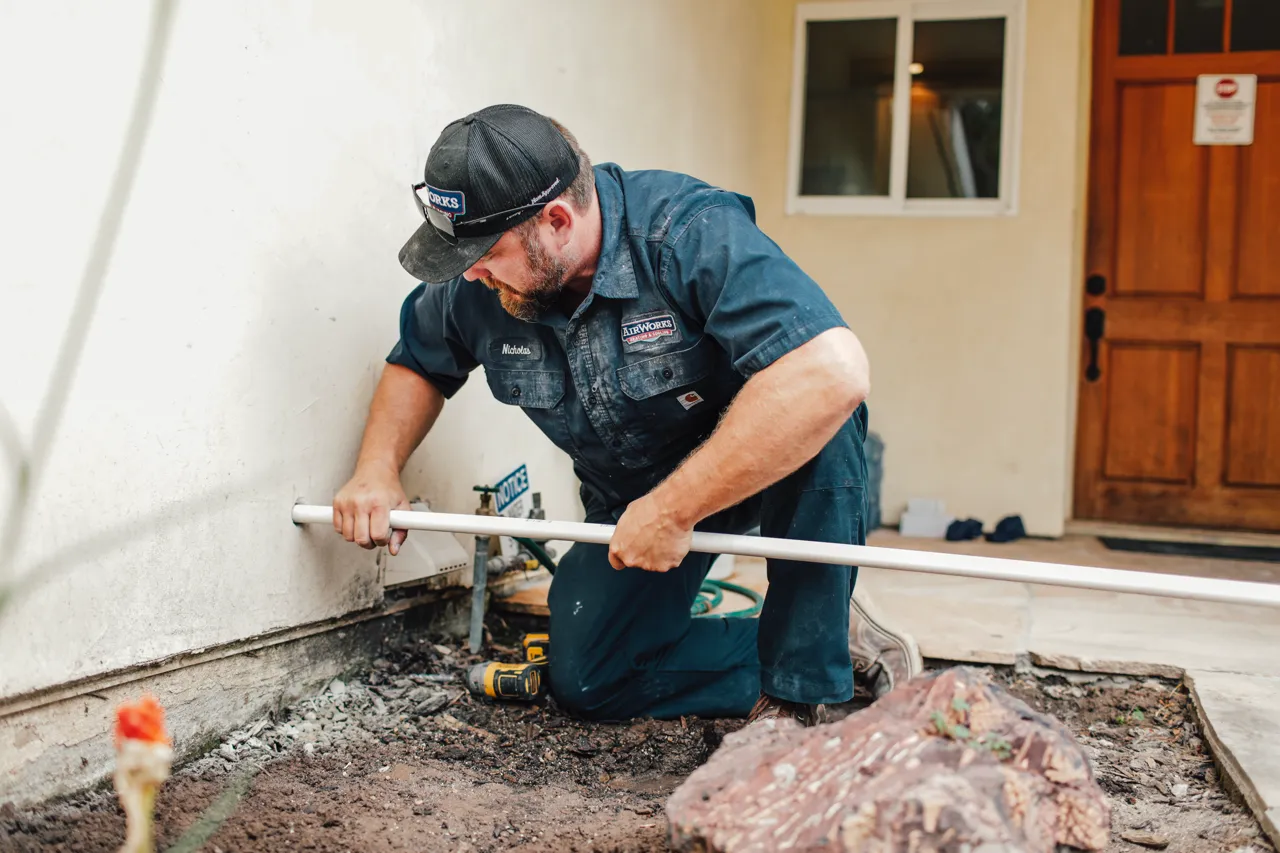 AirWorks plumber completing a water heater installation